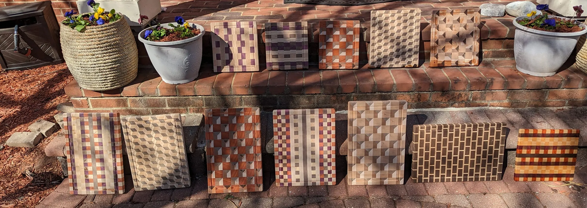 End-Grain Boards & Bowls — A lineup of boards outdoors