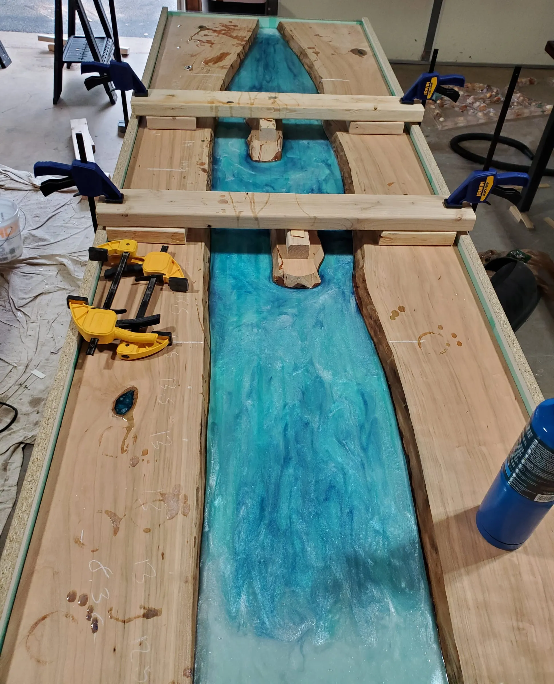 Coffee River Table — Pour day: slabs clamped across the river form