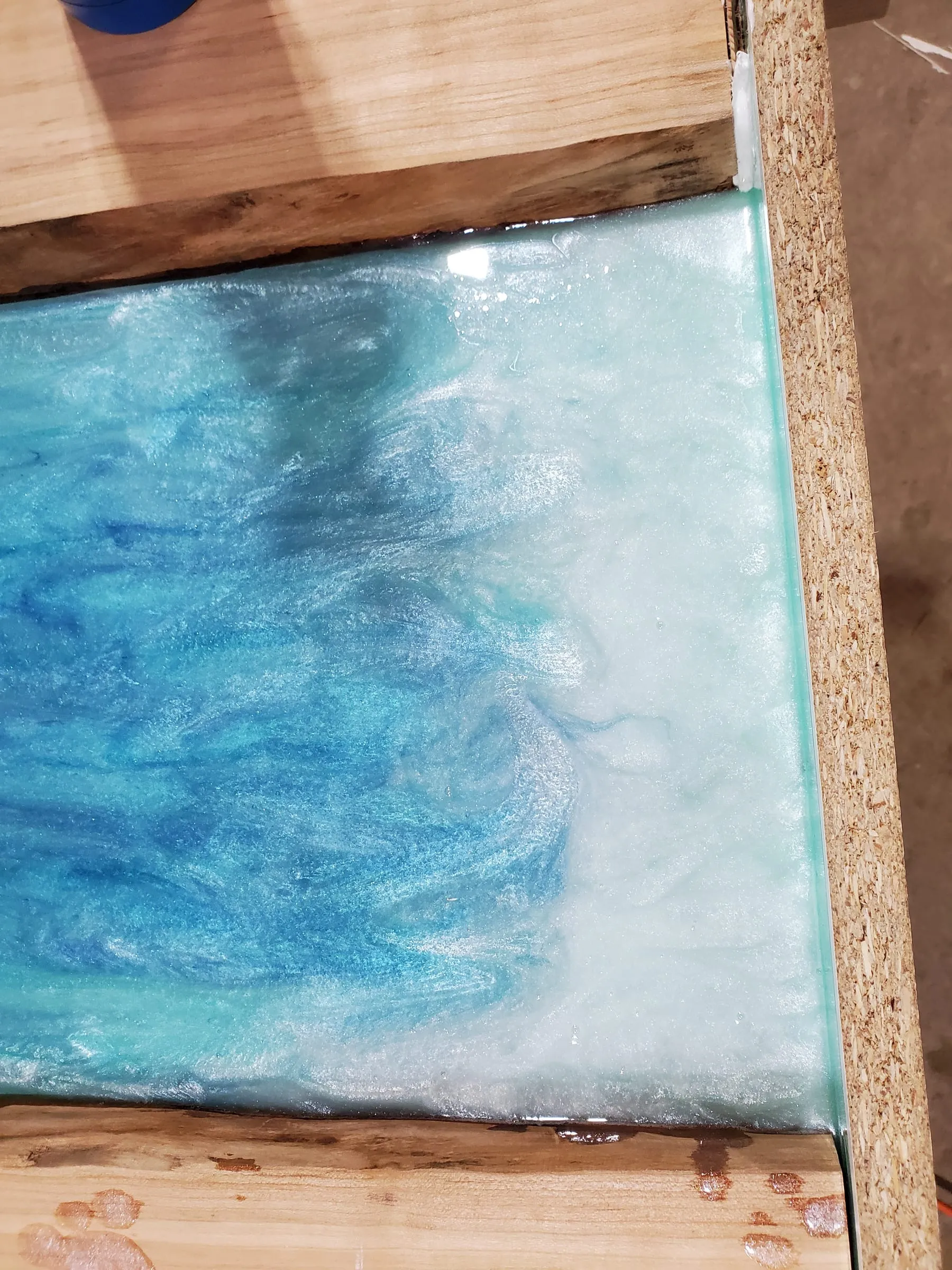 Coffee River Table — Swirling blue and white epoxy up close