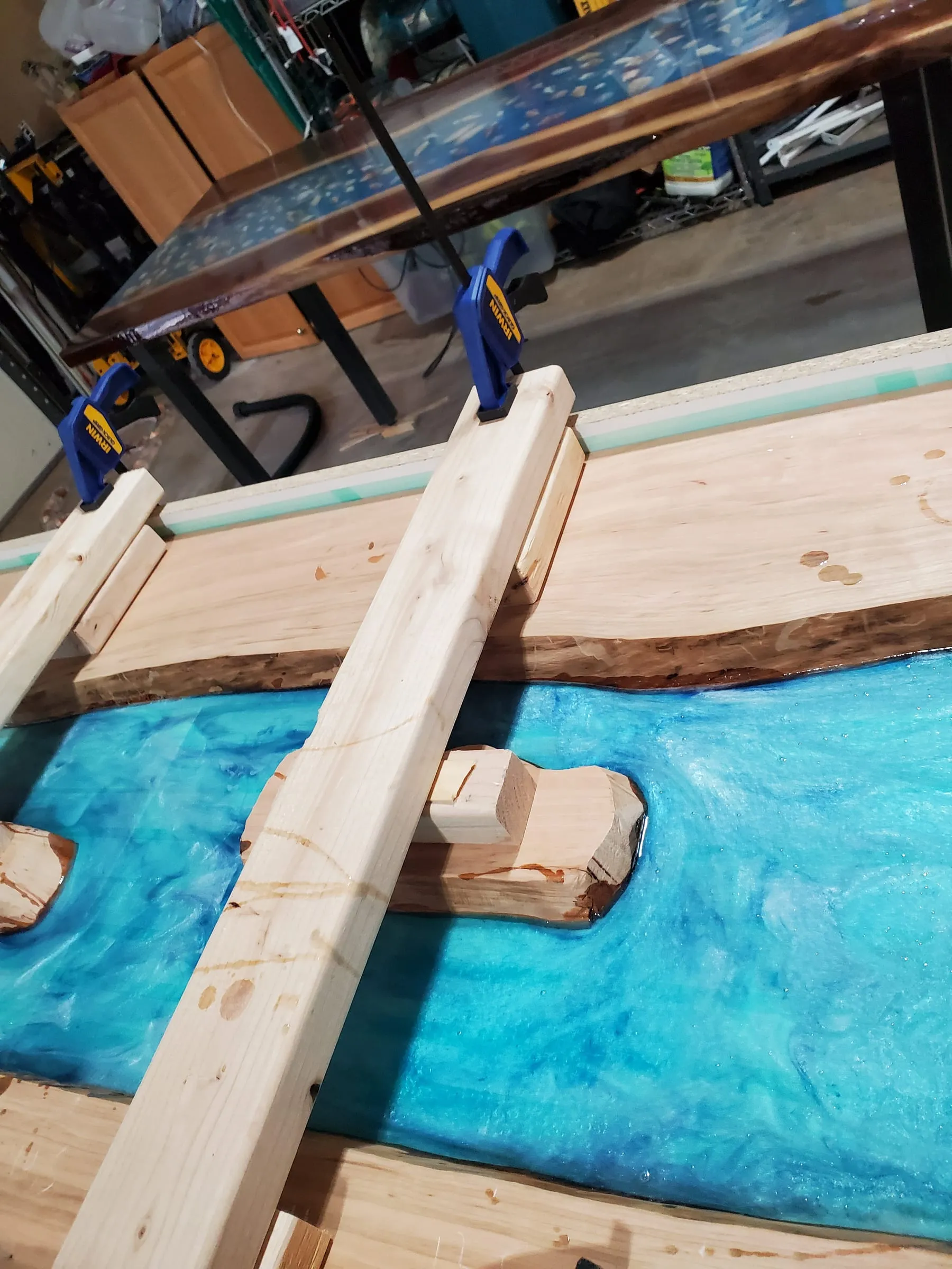 Coffee River Table — A clamped brace keeps the island from floating up