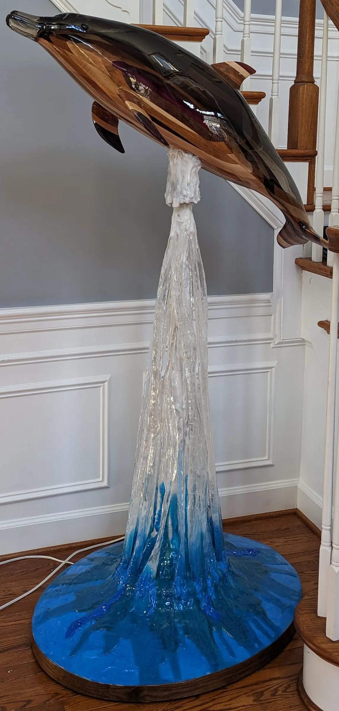 Elvis the Dolphin sculpture leaping from a frozen epoxy splash