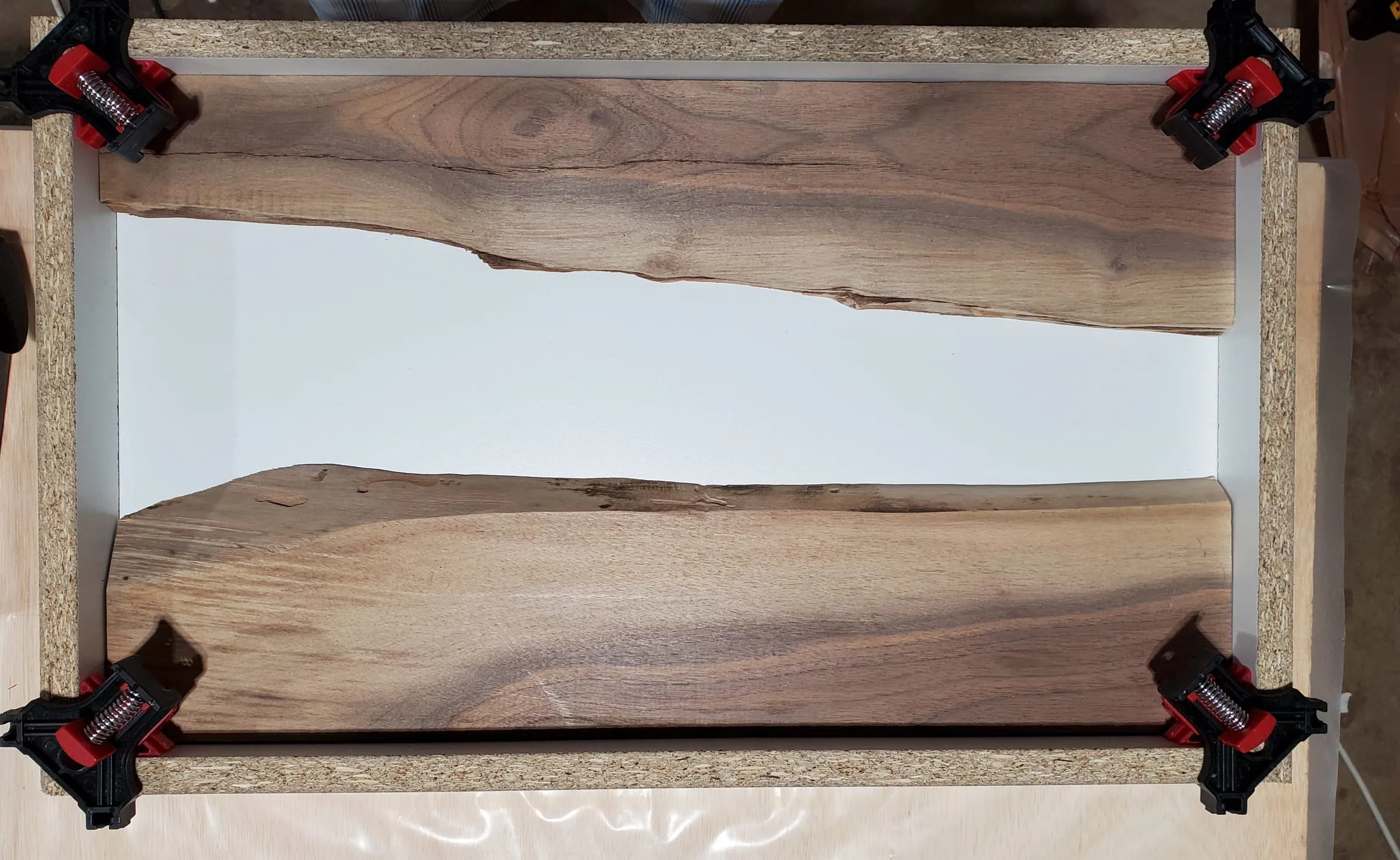 River Shell Trays — Walnut slabs clamped into the form