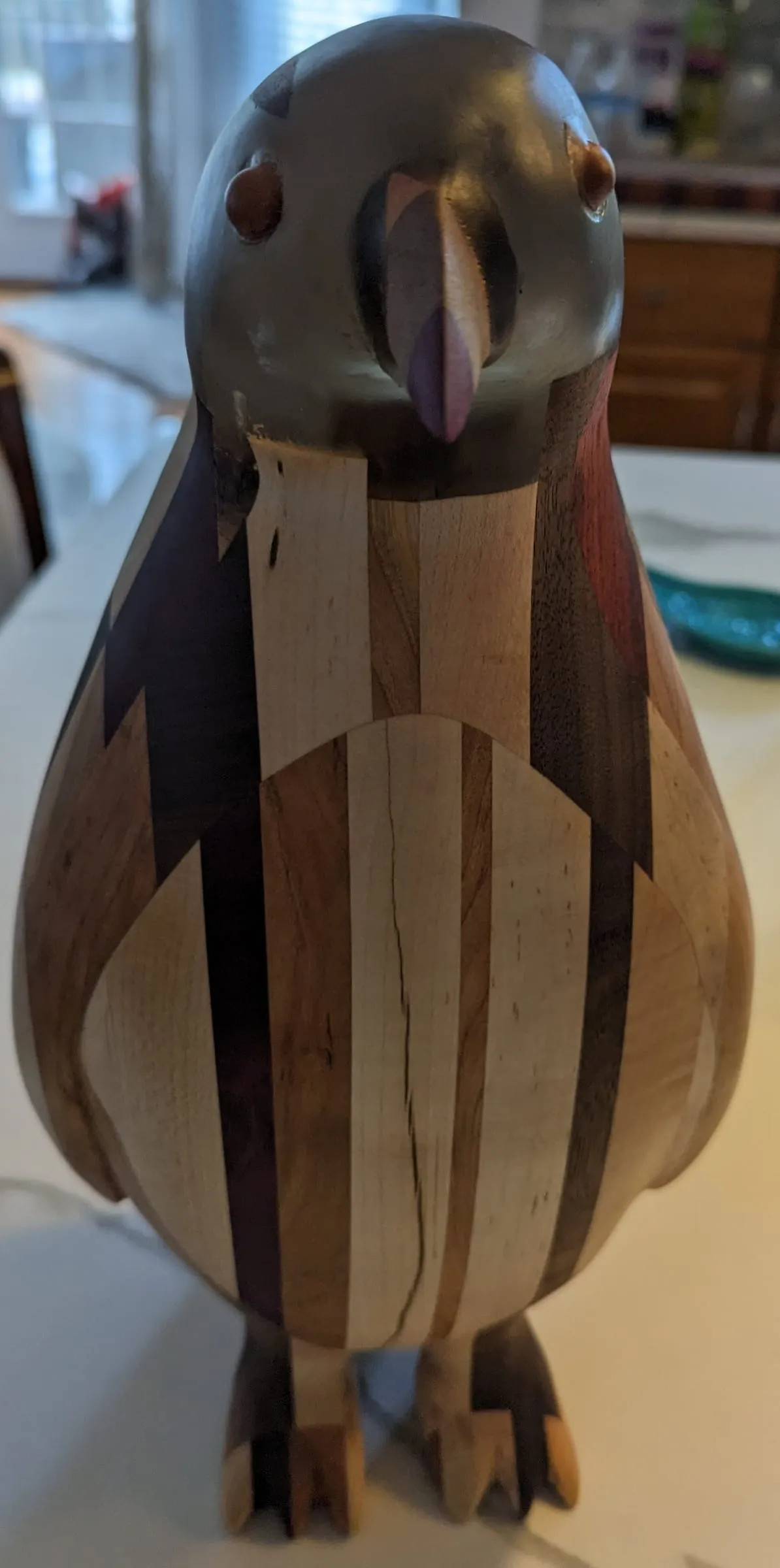 The Penguin — Three-quarter front, showing the stripes and belly inlay