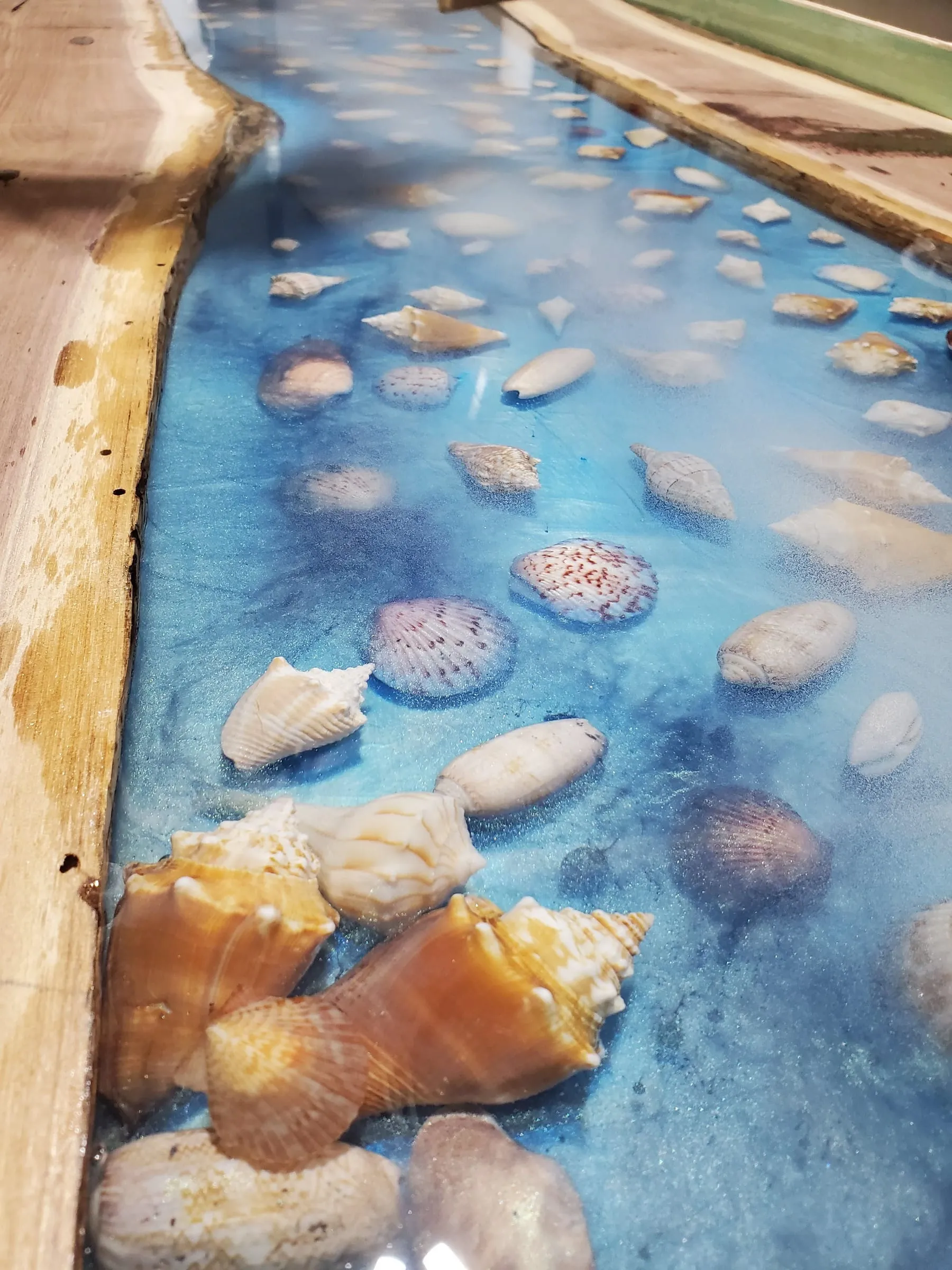 The Outdoor River Table — Shell detail, looking down the river