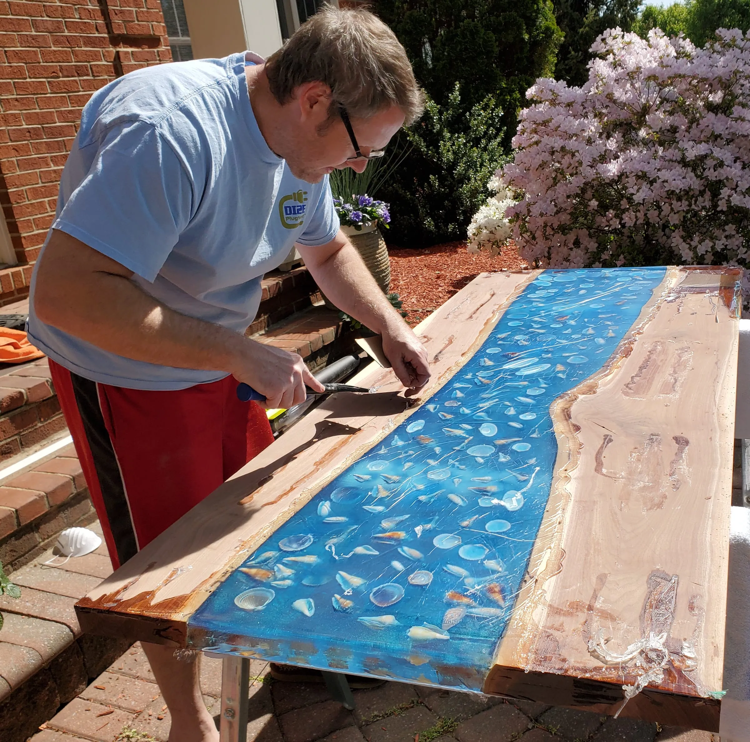 The Outdoor River Table — Working the slab surface by hand
