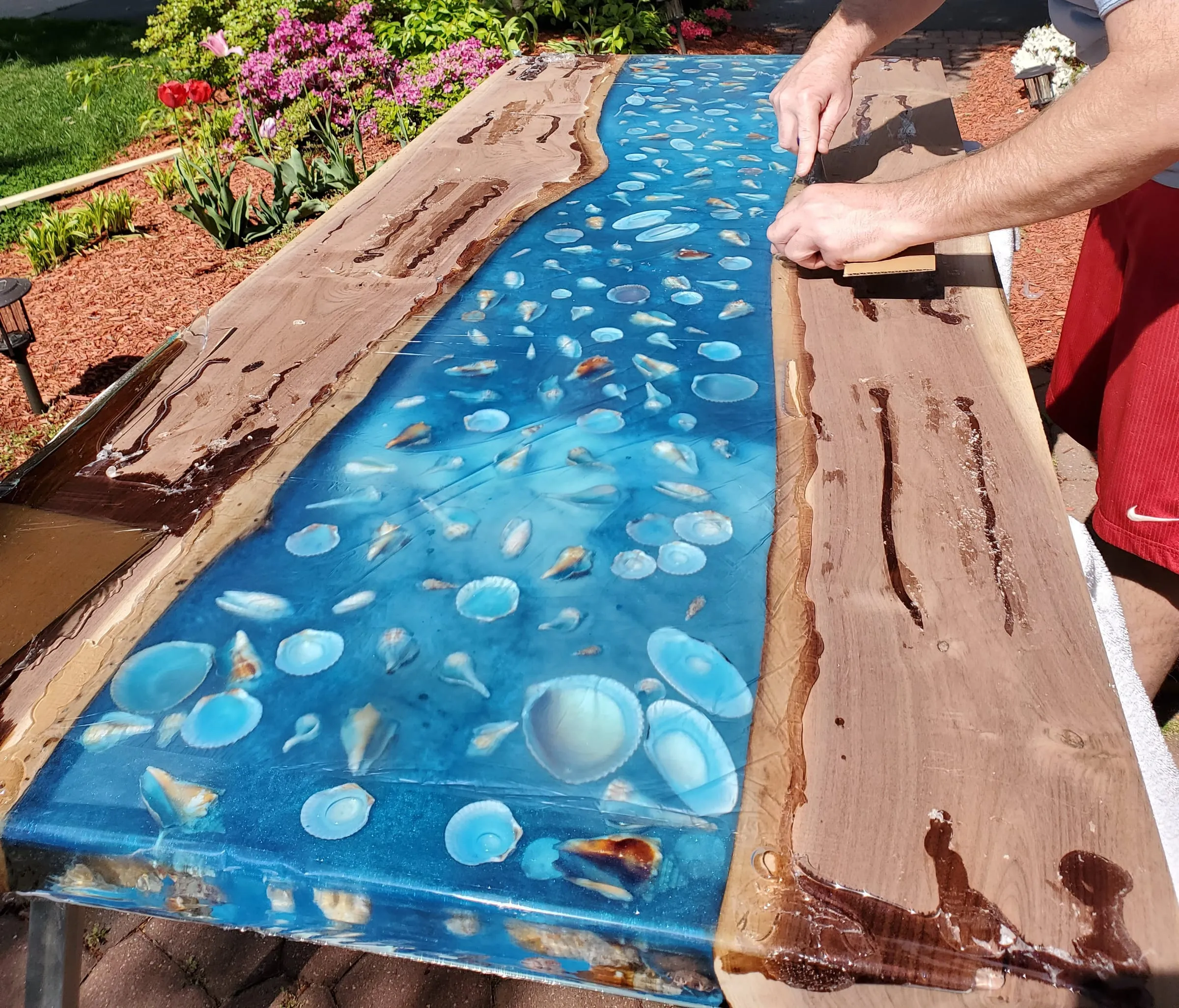 The Outdoor River Table — Scraping back cured epoxy