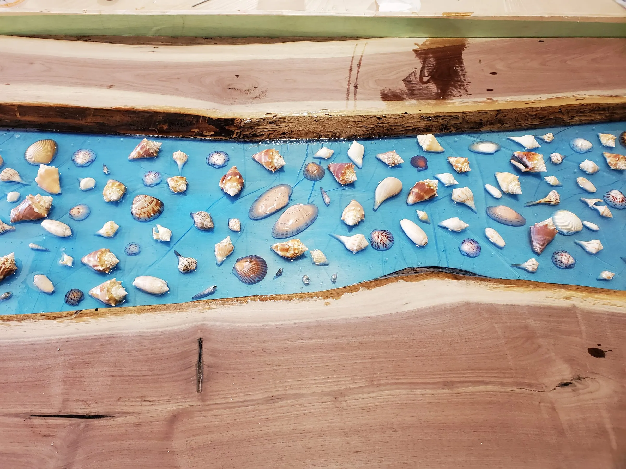 The Outdoor River Table — First layers of epoxy over the shells