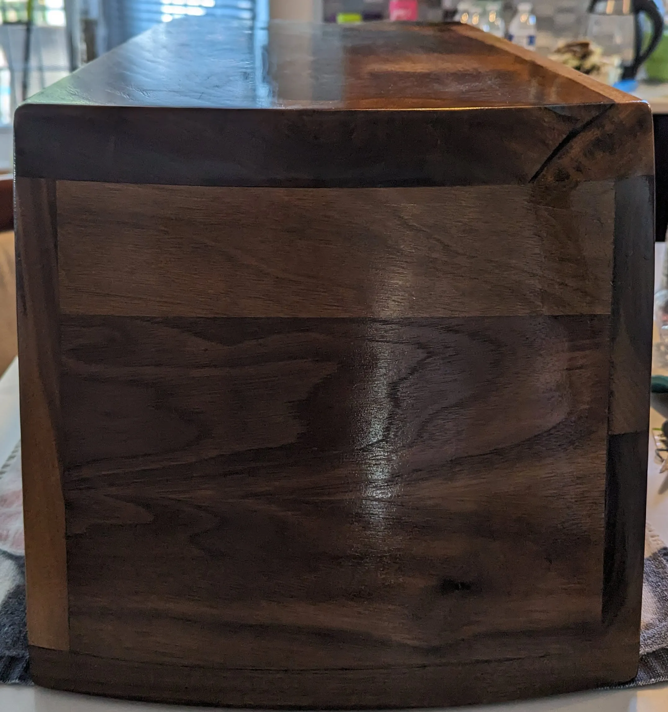 The Waterfall Cabinet — Curved walnut end panel