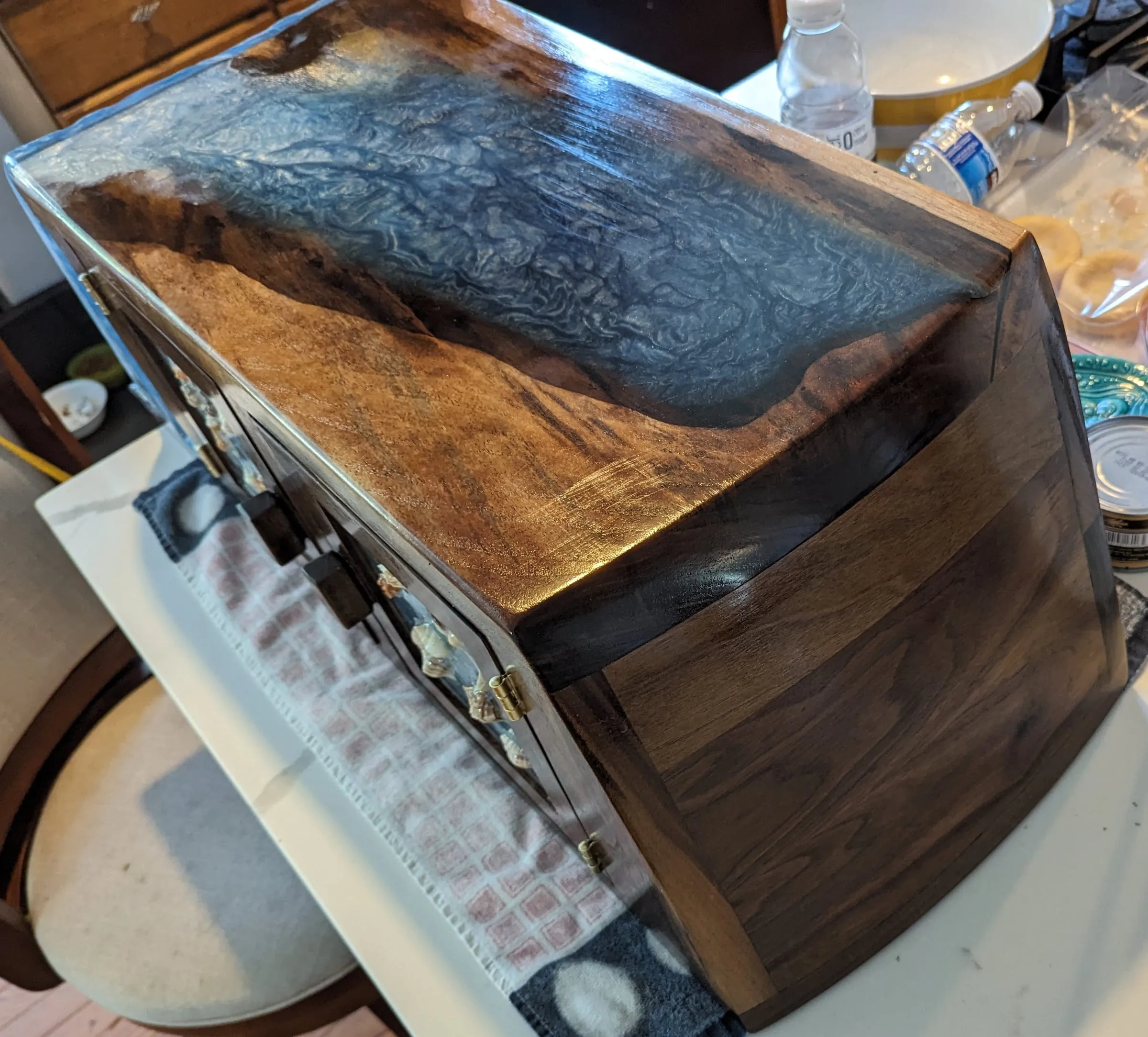 The Waterfall Cabinet — Figured walnut sides and the poured top